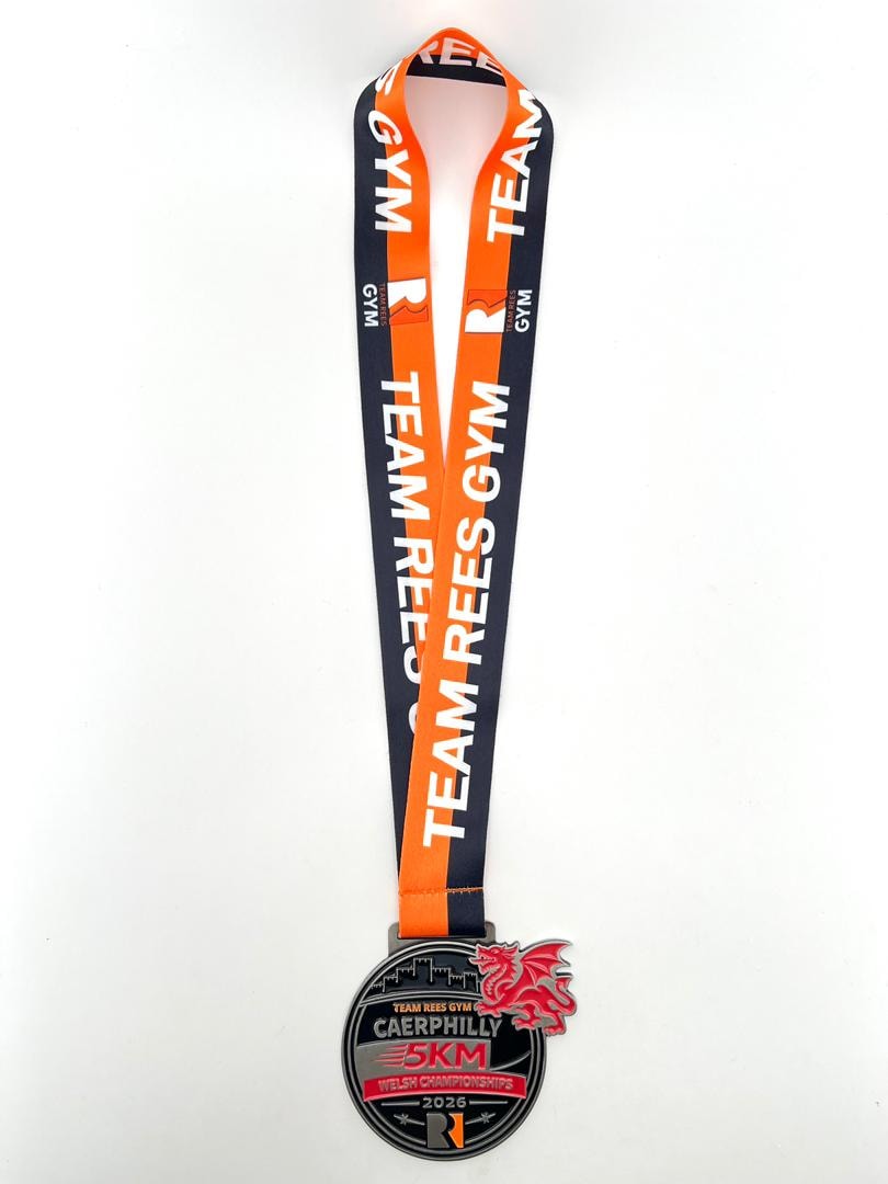 Premium giant Caerphilly 5KM Welsh Championships finisher's medal on Team Rees Gym lanyard