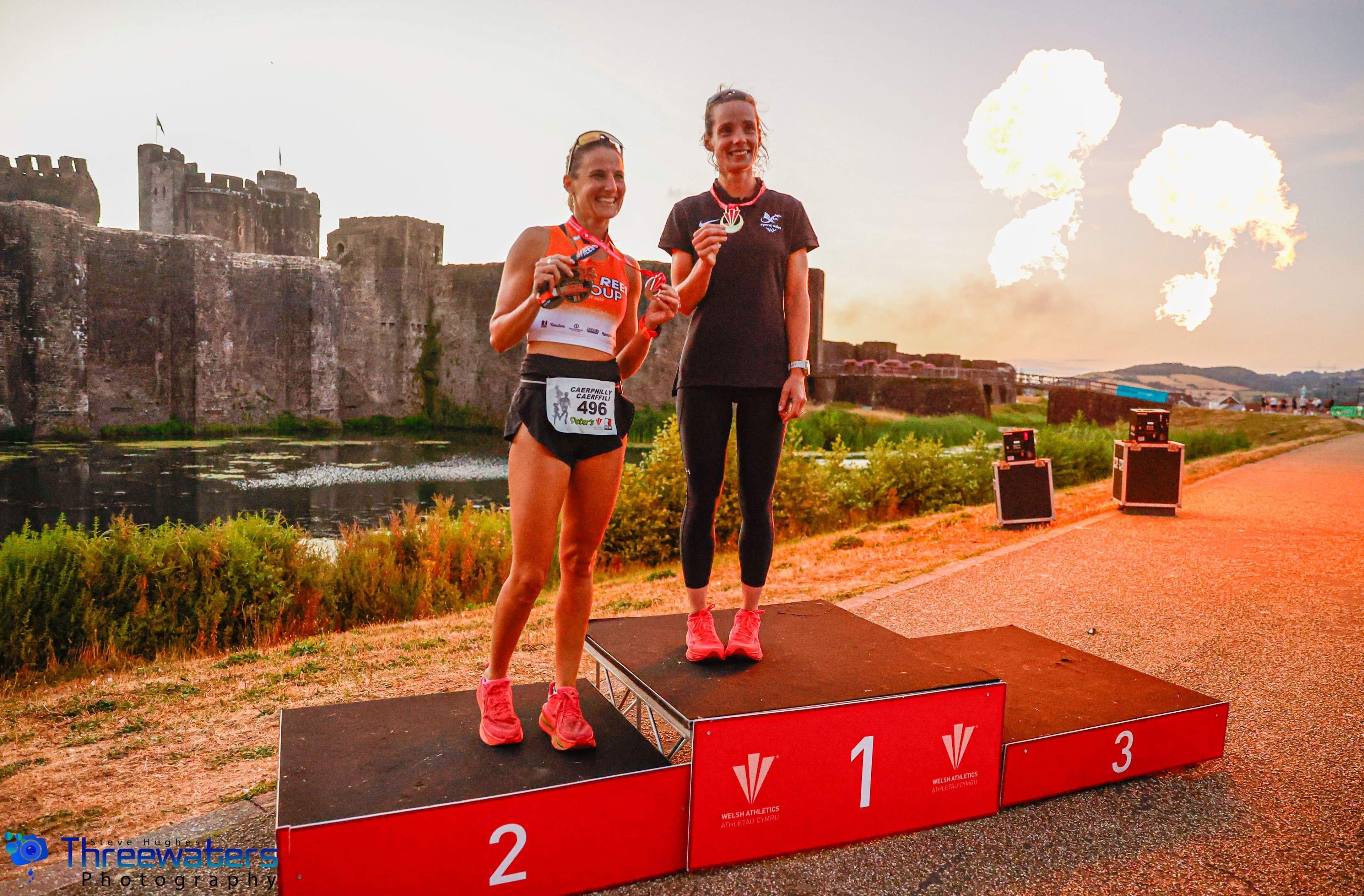 Women's podium at the Caerphilly 5KM Welsh Championships with castle backdrop