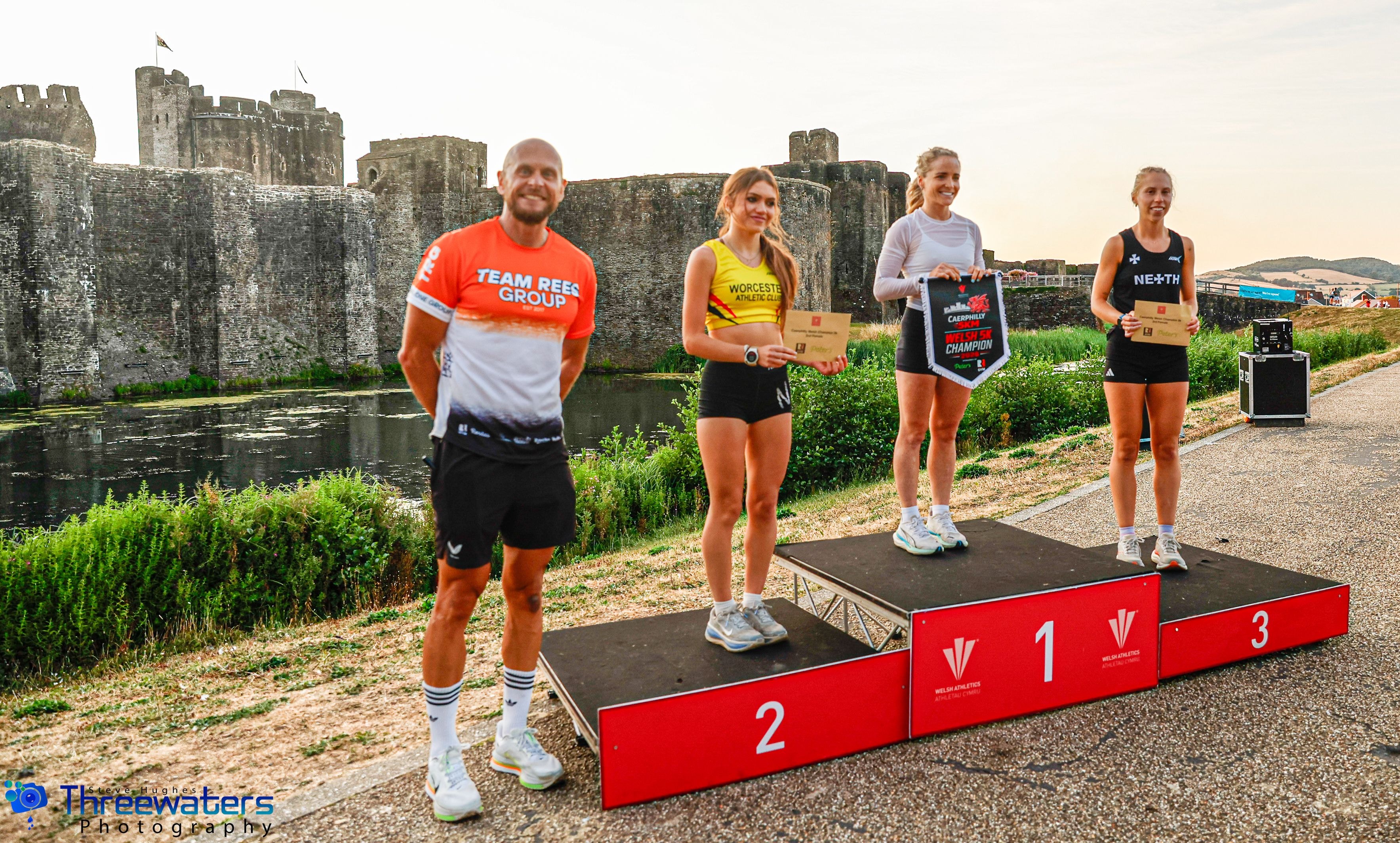 Men's podium at the Caerphilly 5KM Welsh Championships with castle backdrop